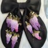 Elegant black hair bow with hand-embroidered purple blooms