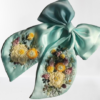 shiny silk bow with hand-sewn flowers